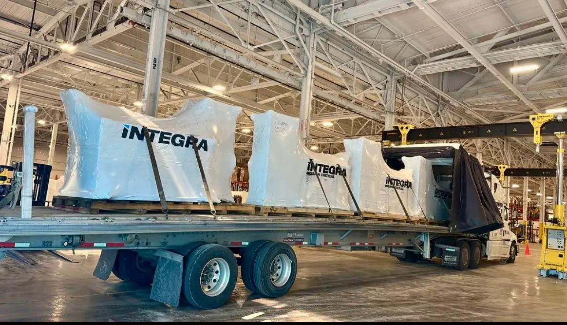 Trans Link team member strapping Integra cargo